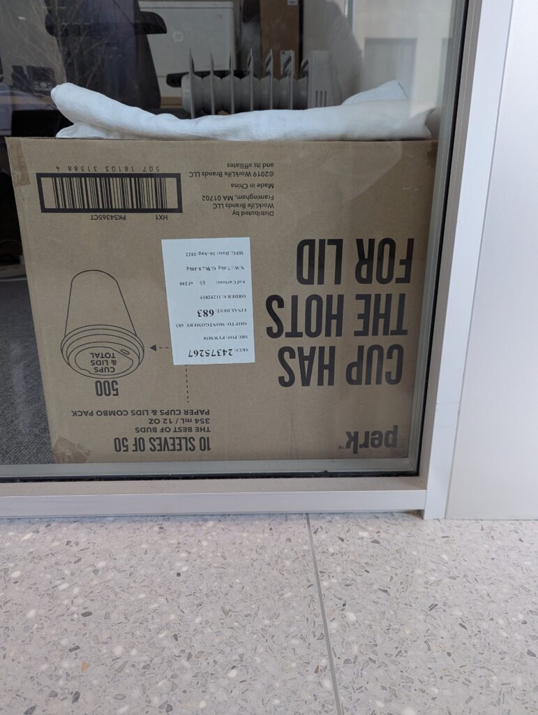 Upside-down box of cups that reads "Cup has the hots for lid"